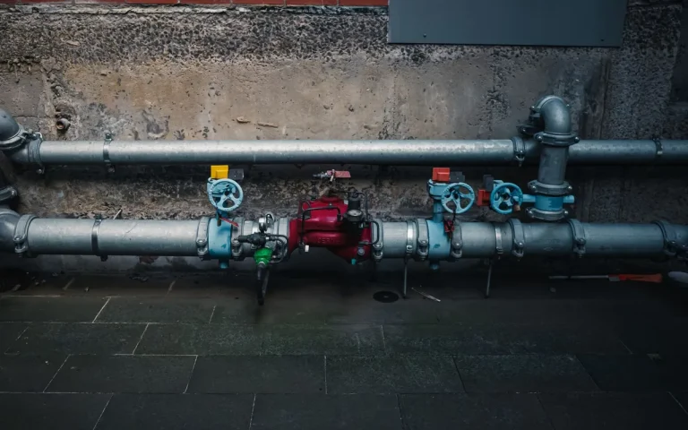 Pipes and valves on a building wall, commercial plumbing in Medley, FL